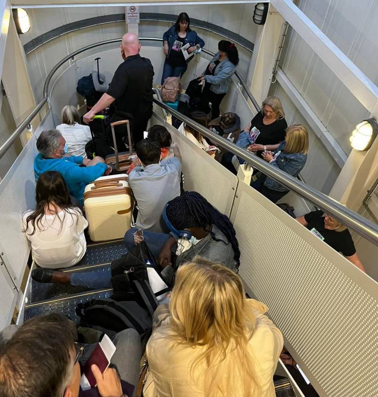 <span style='color:#780948'>ARCHIVED</span> - 180 Alicante-bound Ryanair passengers spend three hours trapped in flight corridor at Manchester Airport