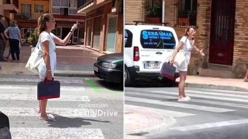 <span style='color:#780948'>ARCHIVED</span> - VIDEO: Woman bizarrely gesticulating to motorists brings Benidorm traffic to a standstill