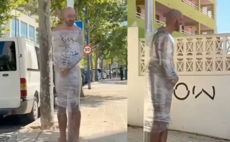 Drunken Brit antics: Naked man wrapped in cling film and tied to lamppost in Benidorm, Spain
